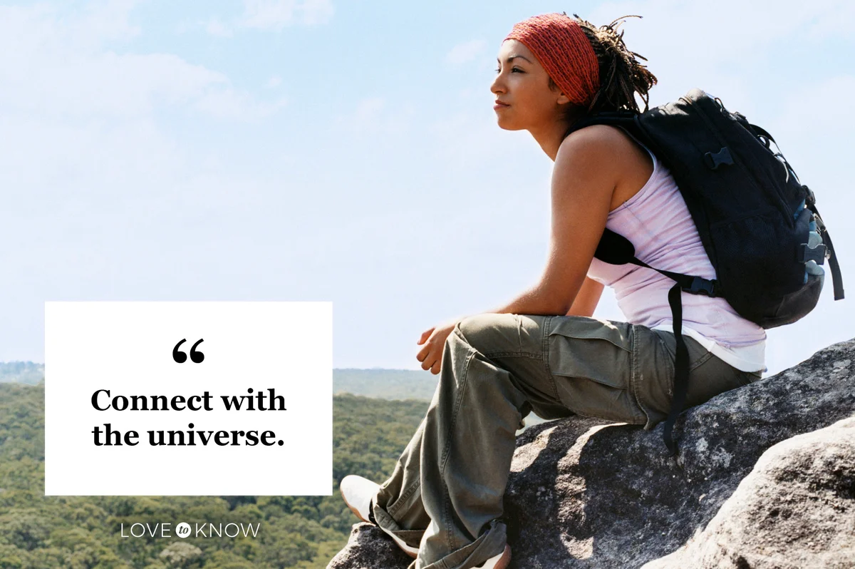 woman sitting on mountain top