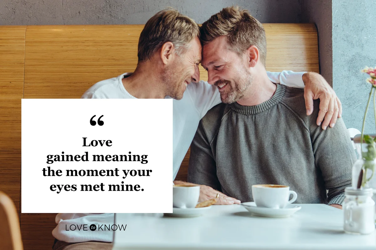 male couple looking into each others eyes