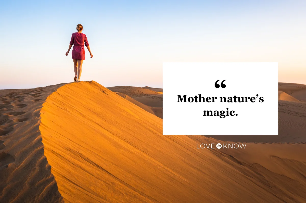 Girl walking on sand dunes at sunset and wearing dress