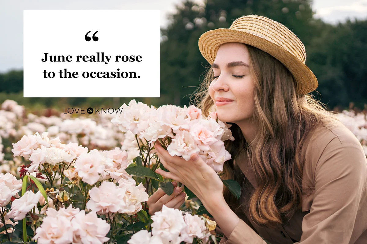 Woman enjoying the beautiful smell of blossom roses