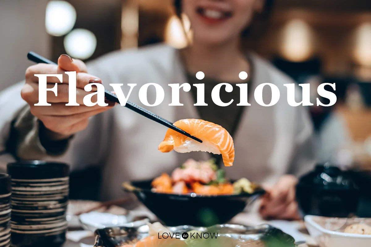 Woman enjoying delicate freshly served sushi with chopsticks