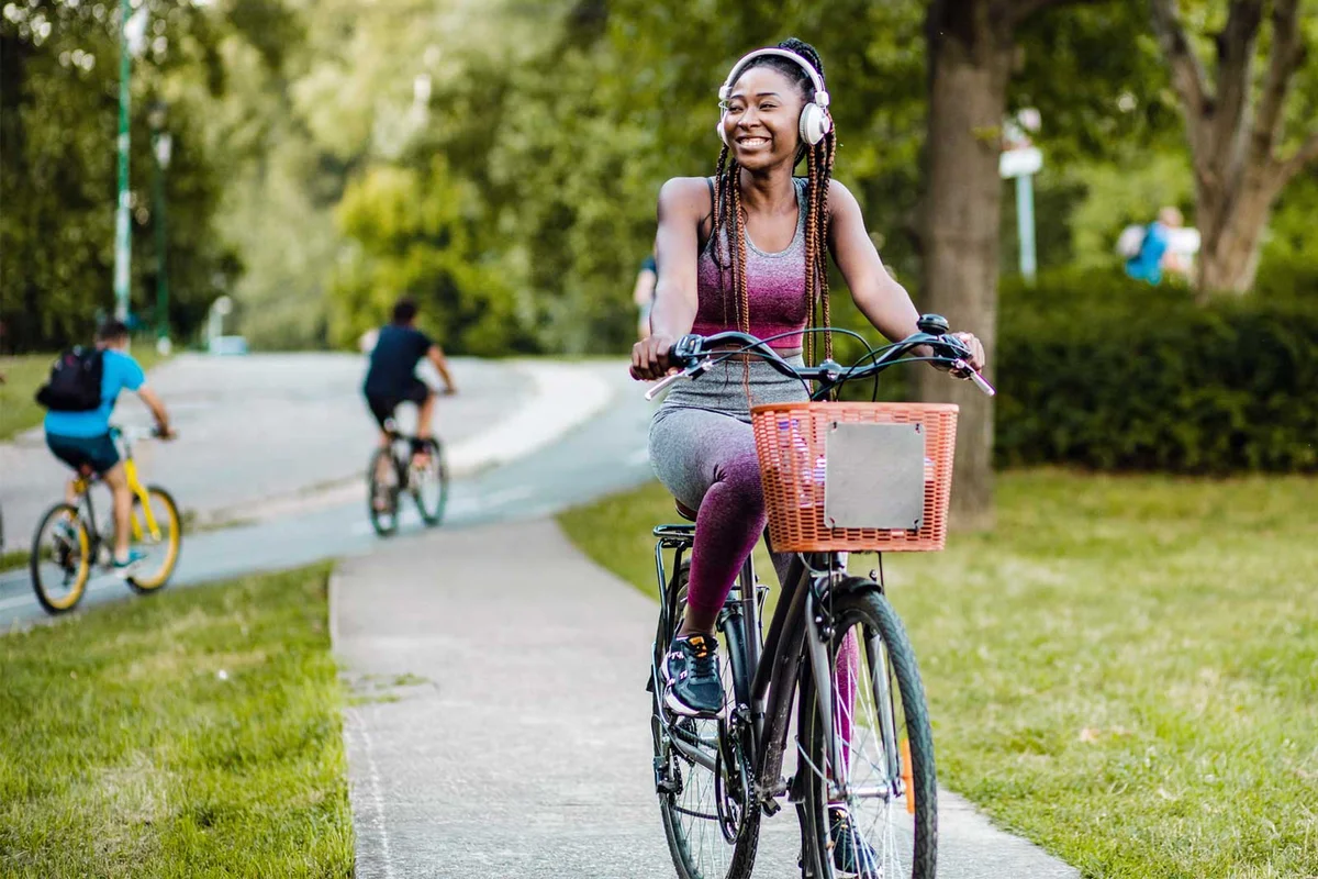 woman riding bicycle in neighborhood