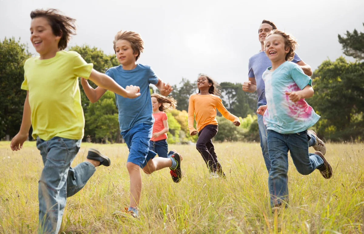 Children running in park
