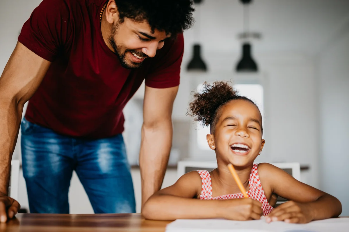 girl and father doing homework