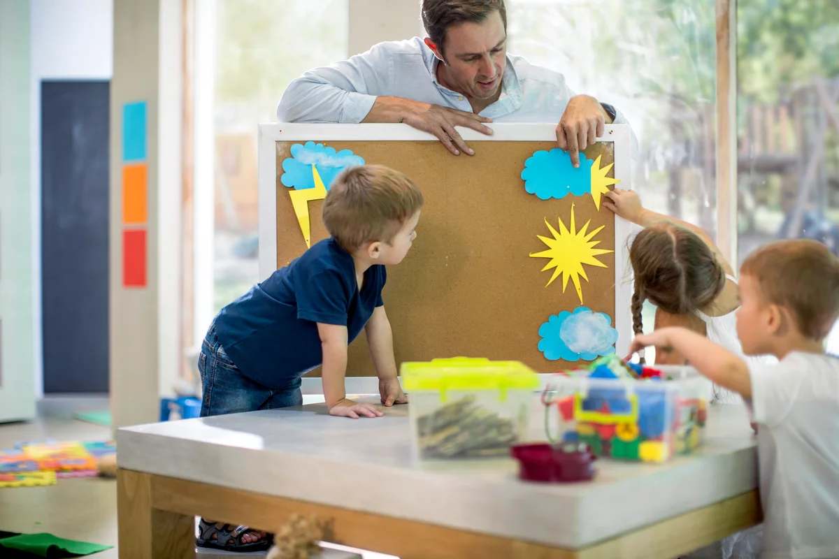 Teacher teaching weather to children