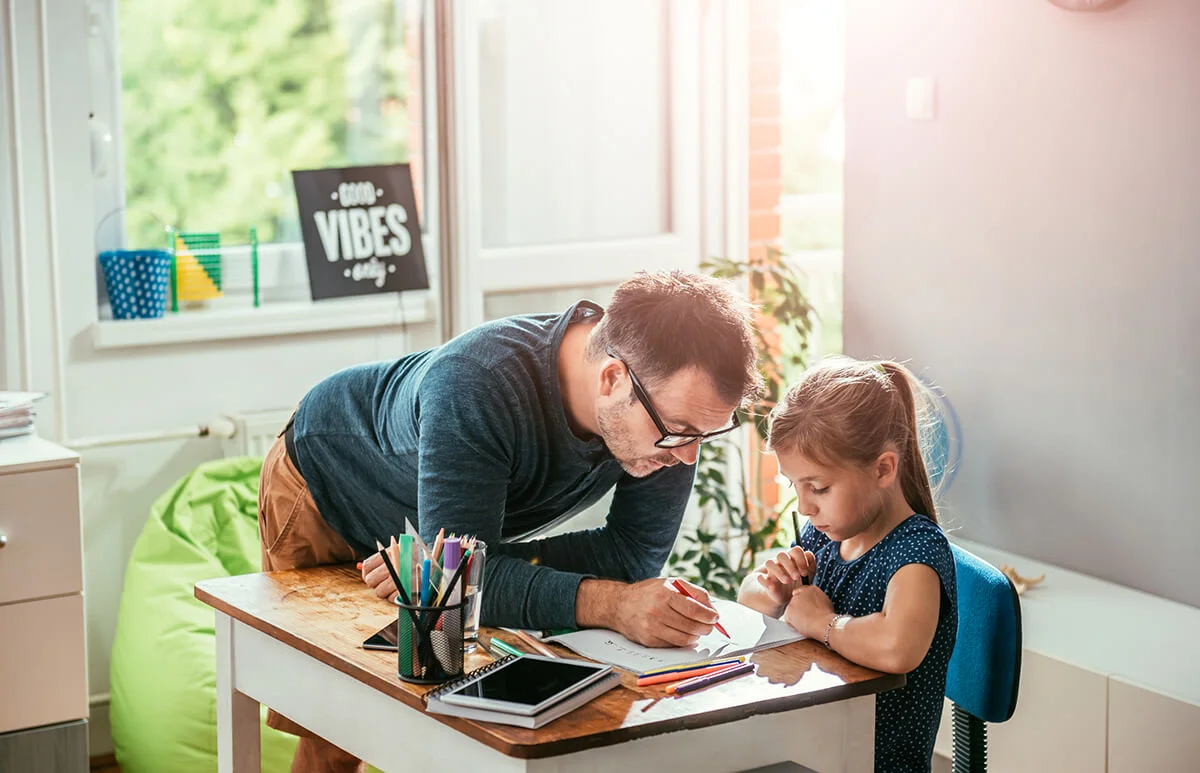 Father homeschooling daughter