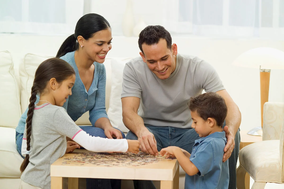 Family Working on Puzzle