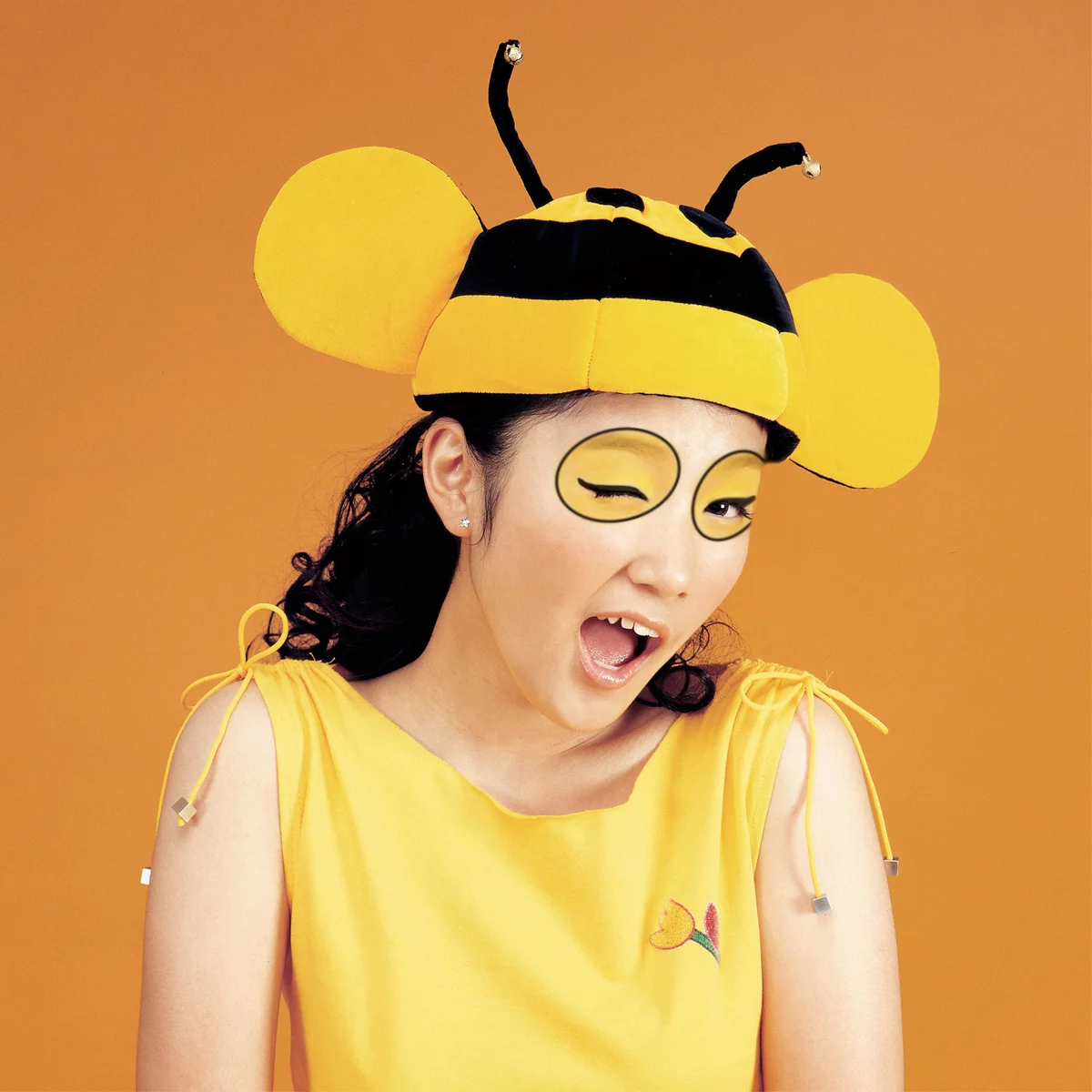 Woman with bumblebee makeup winking
