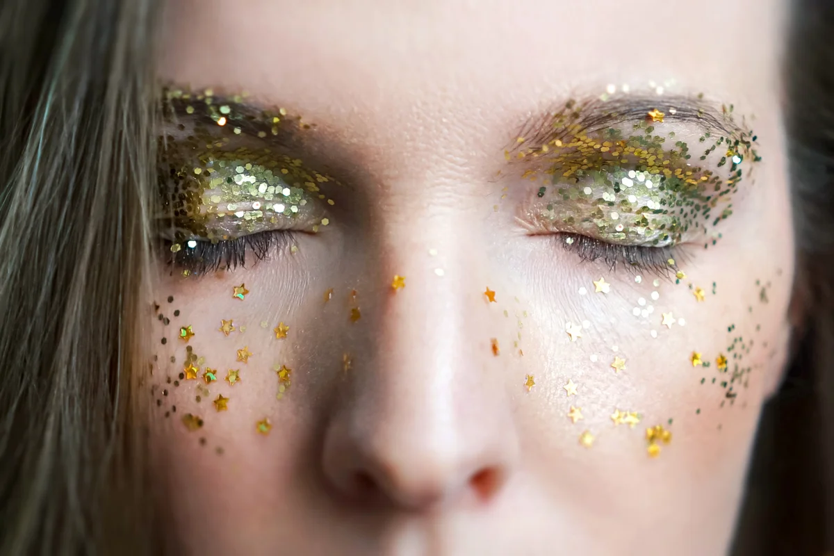Girl with sparkles on face