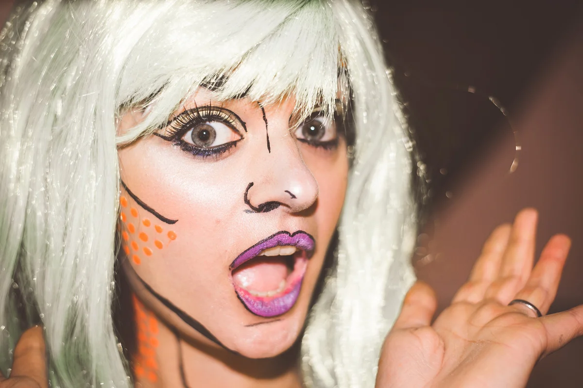Portrait Of Shocked Young Woman Wearing Pop Art Costume