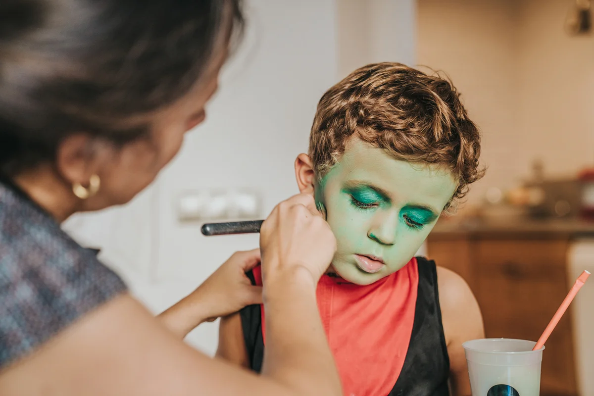 Boy wearing makeup during Halloween