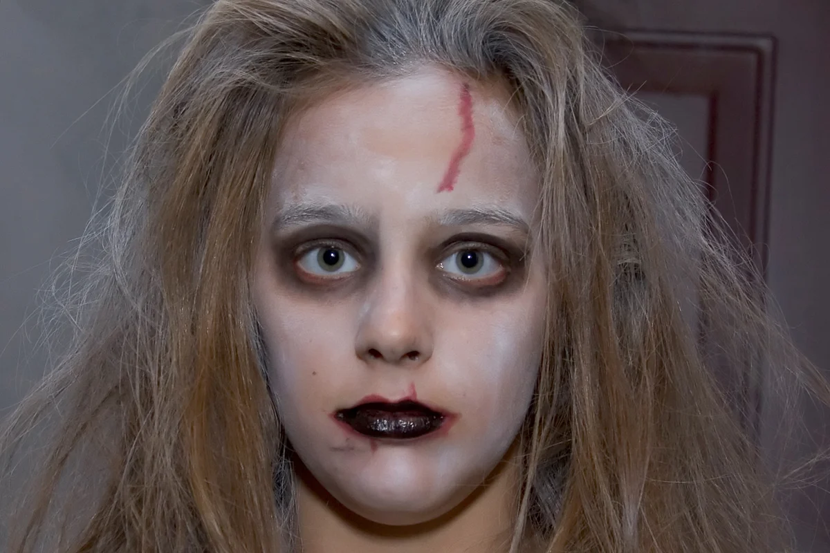 Girl wearing ghost makeup