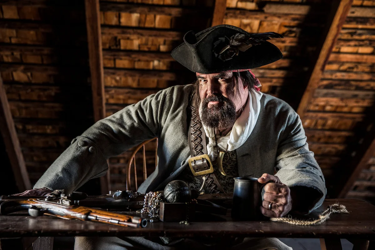 Male Pirate in black hat with dirt on face