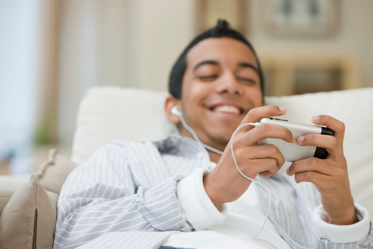 Teenage boy playing video game