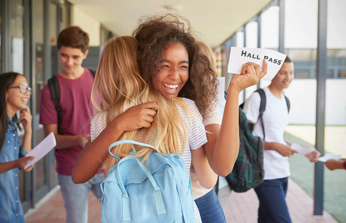 Two girls celebrating exam results