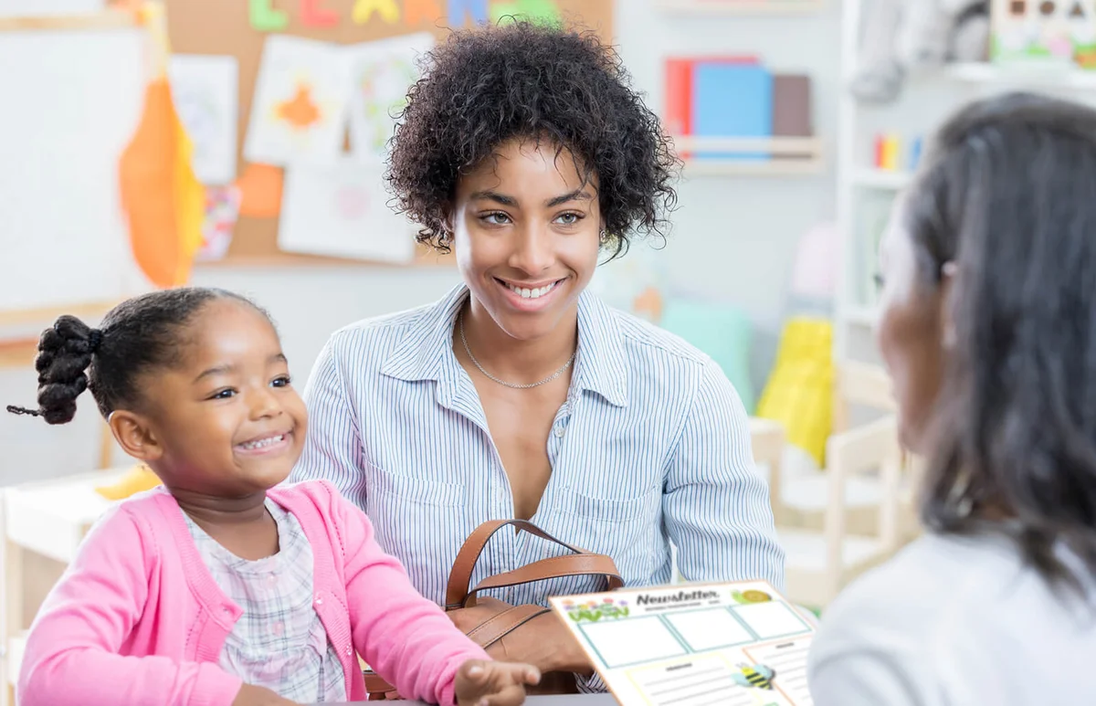 mom talks with teacher during conference