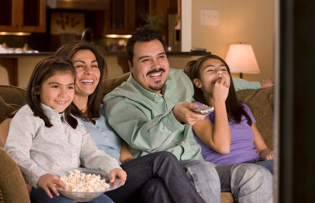 family watching television together