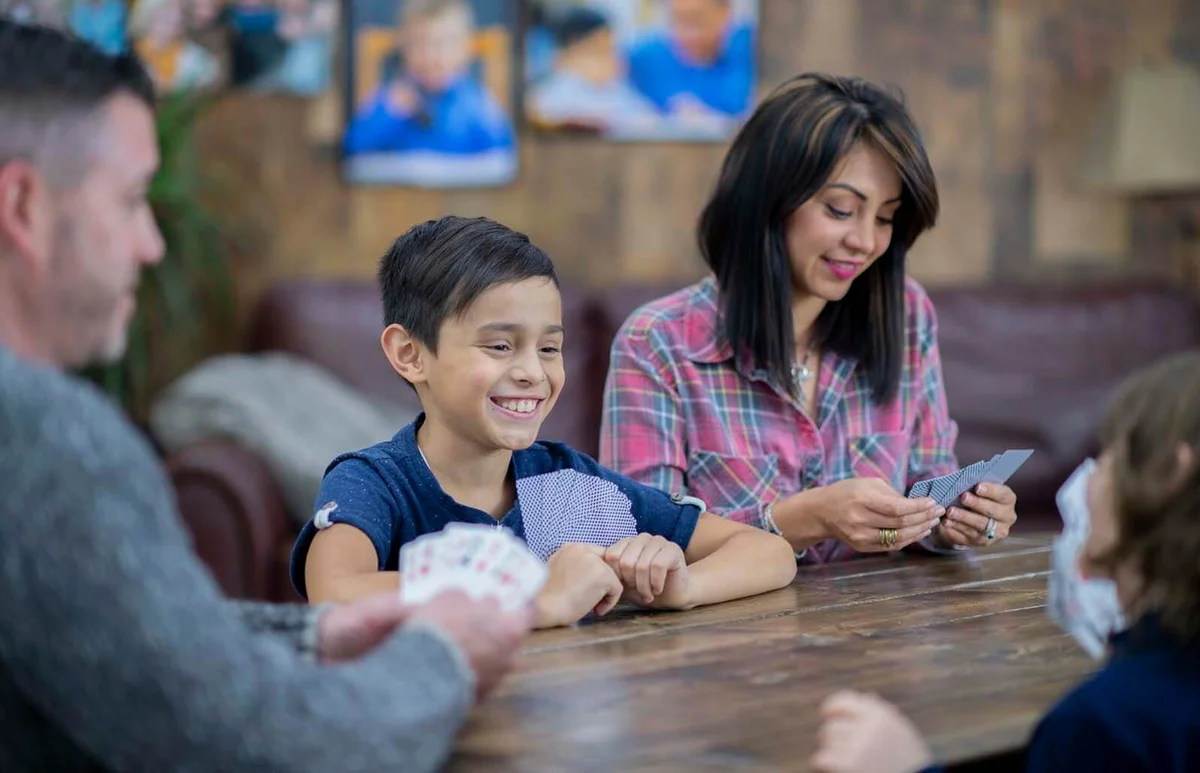 family enjoys games and dinner