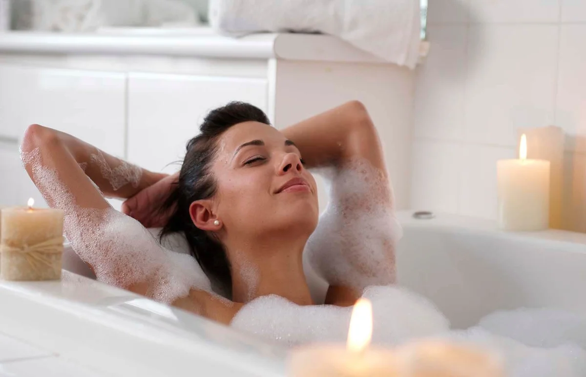 Young woman in bubble bath