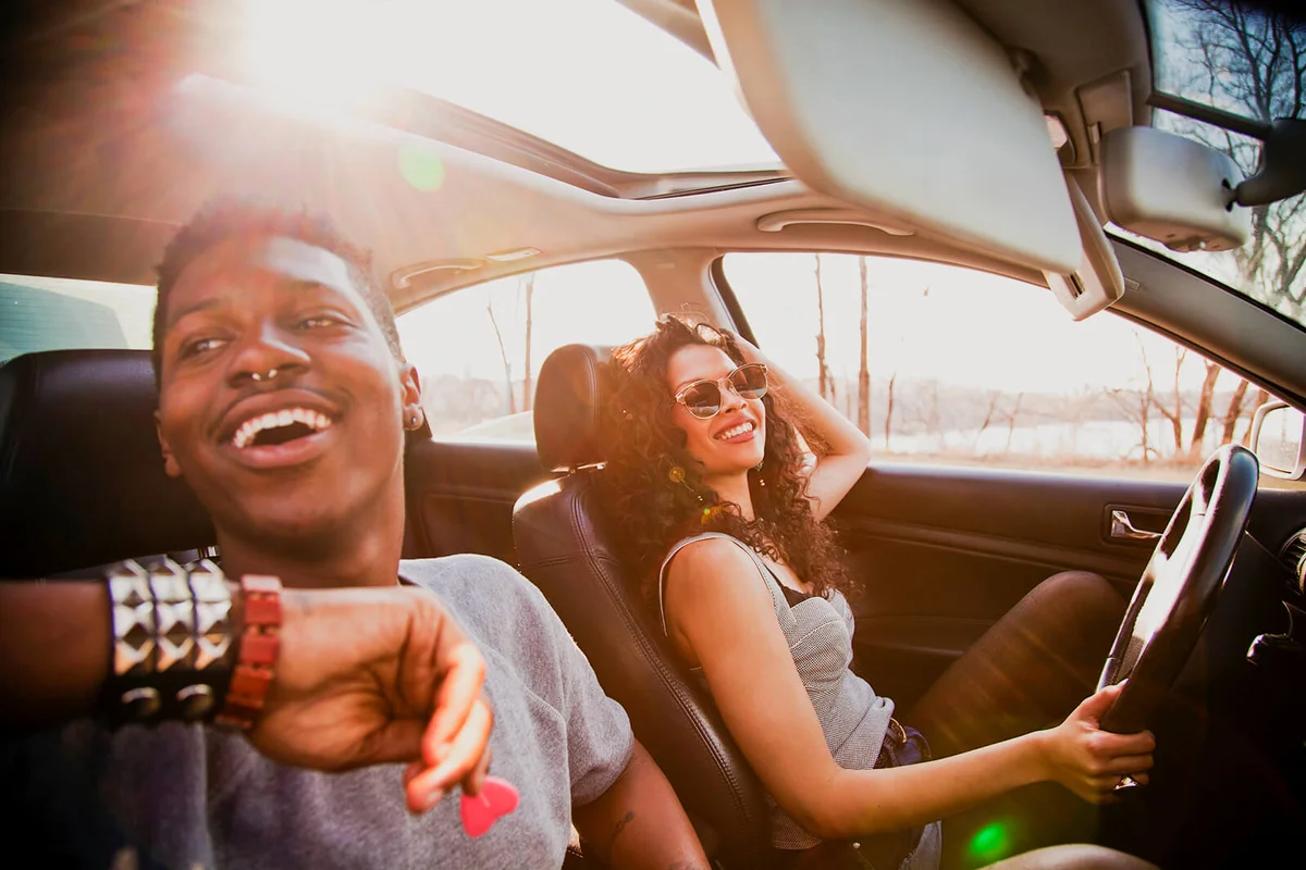 Couple in car on road trip