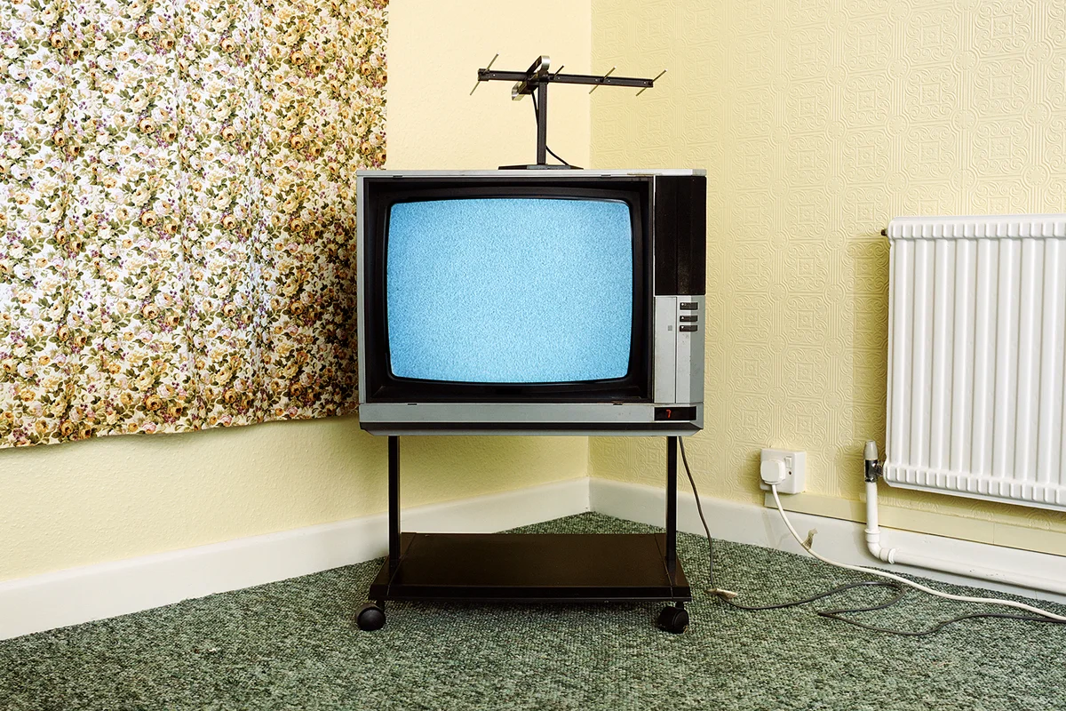 Fuzzy Television in Corner of Room