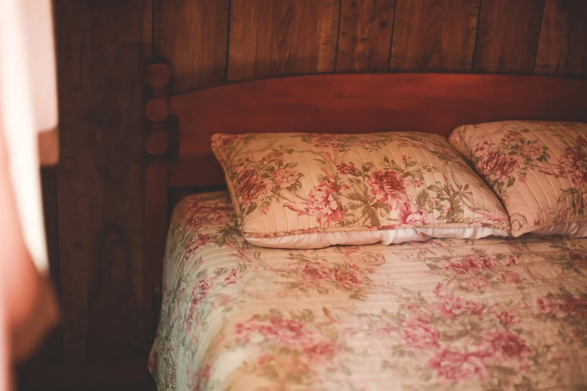 Empty Bed in Old Fashioned Bedroom