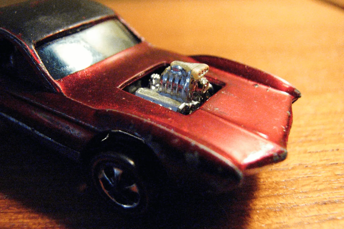 Vintage 1968 Hot Wheels Redline Python. "Original 16", made in Hong Kong. Spectraflame Red with black roof, brown interior