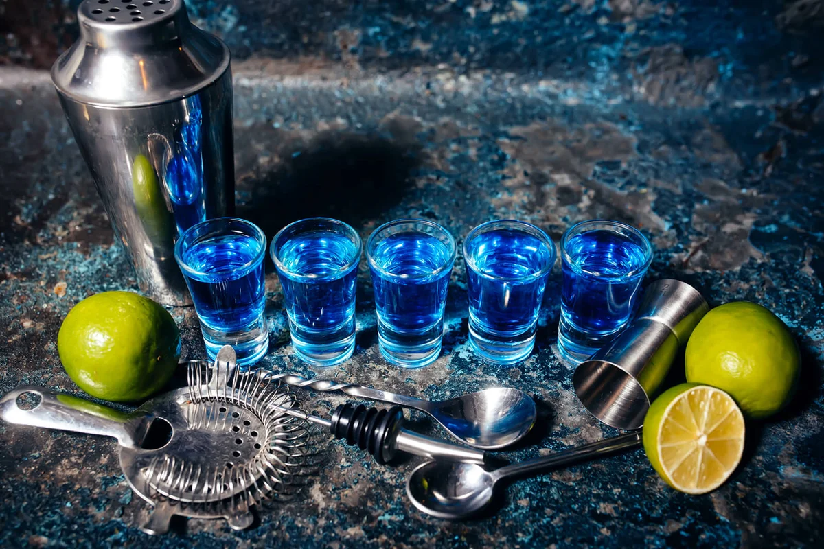 shot blue cocktails and lime