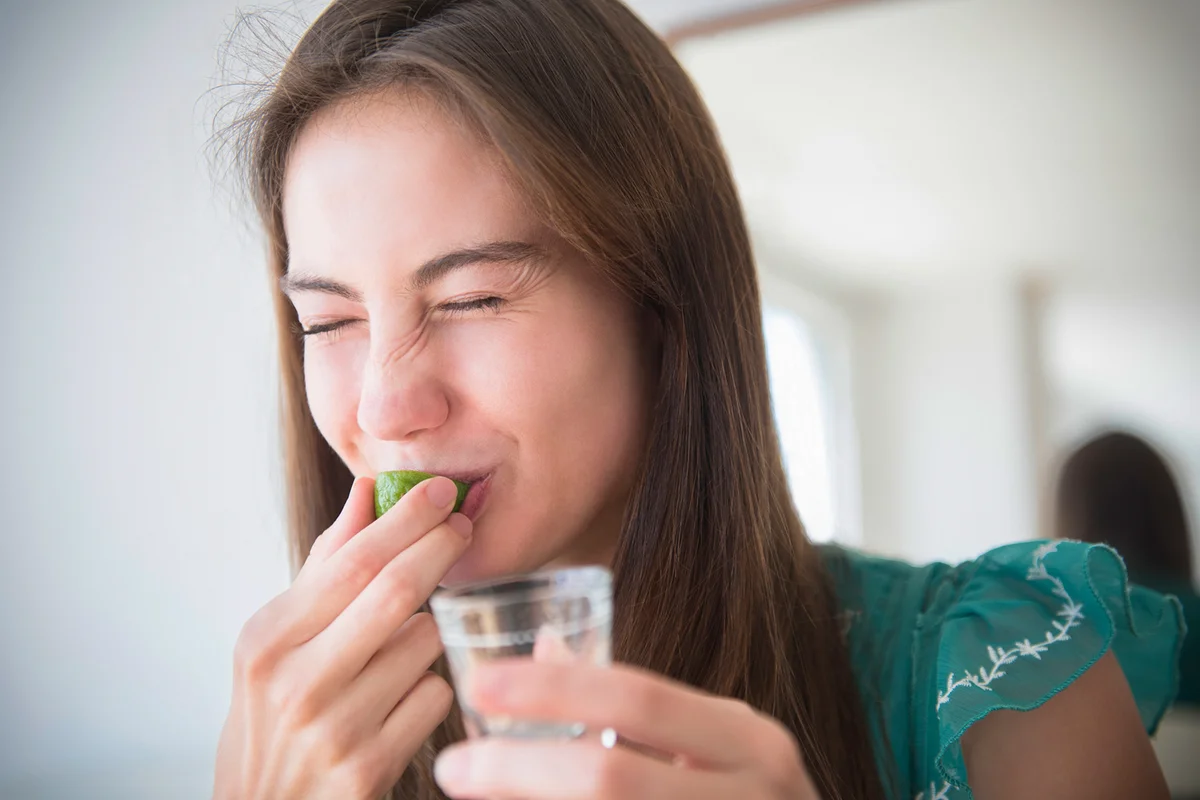 woman drinking tequila shot