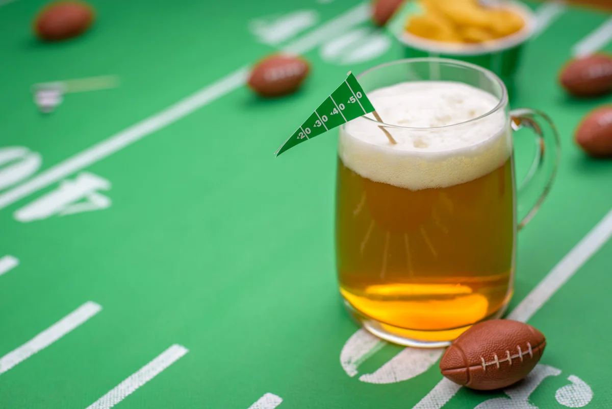 Super bowl game and a mug of shandy