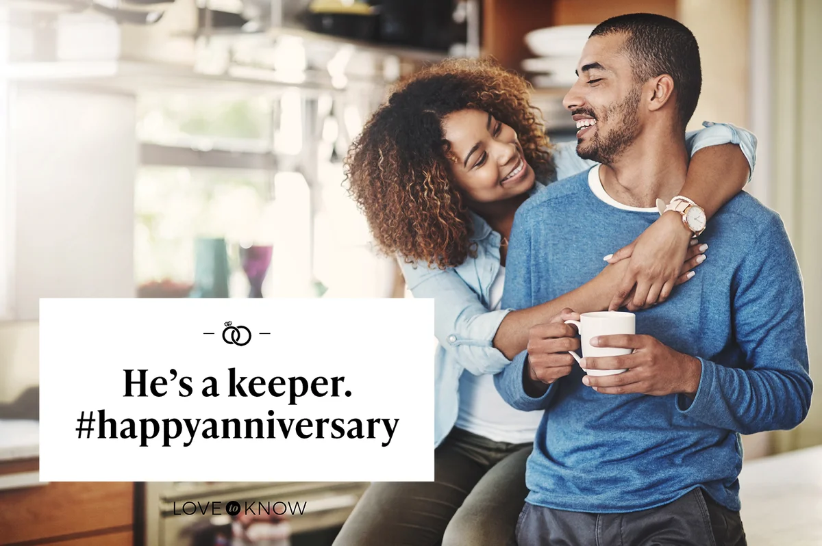 Happy young married couple relaxing in the kitchen