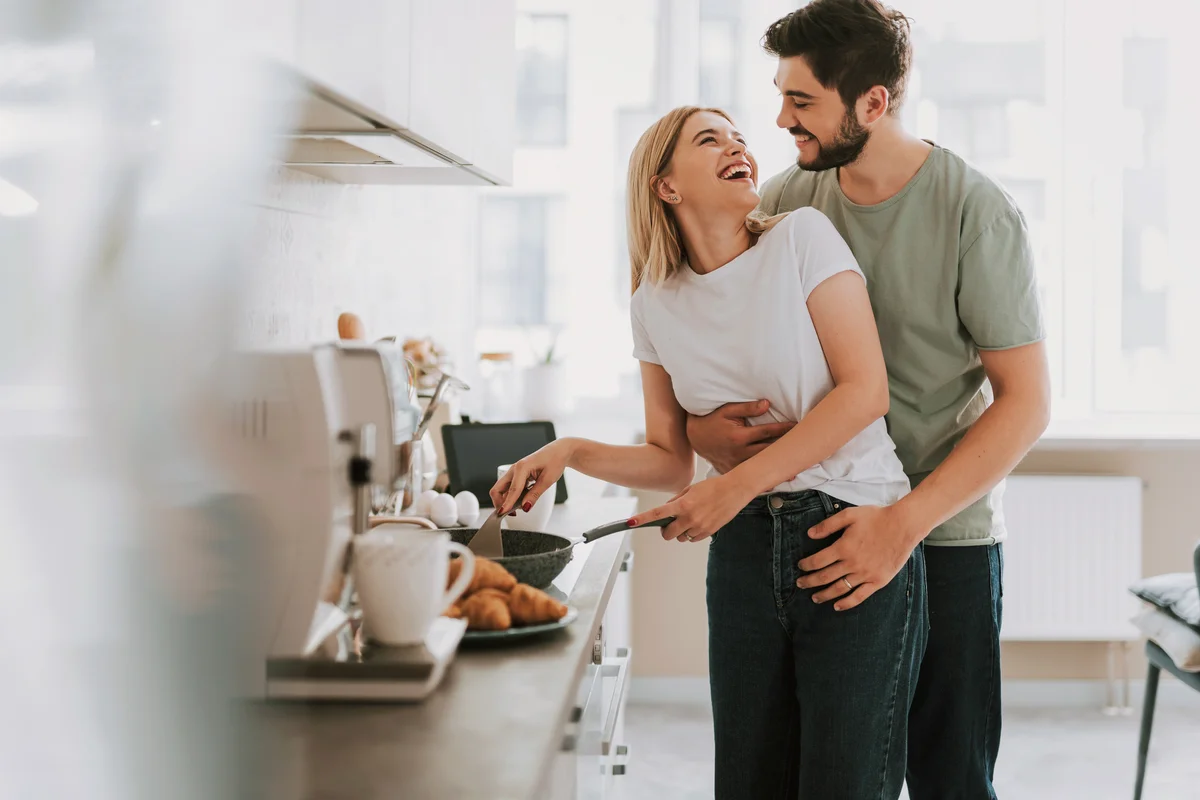 Happy married couple making breakfast