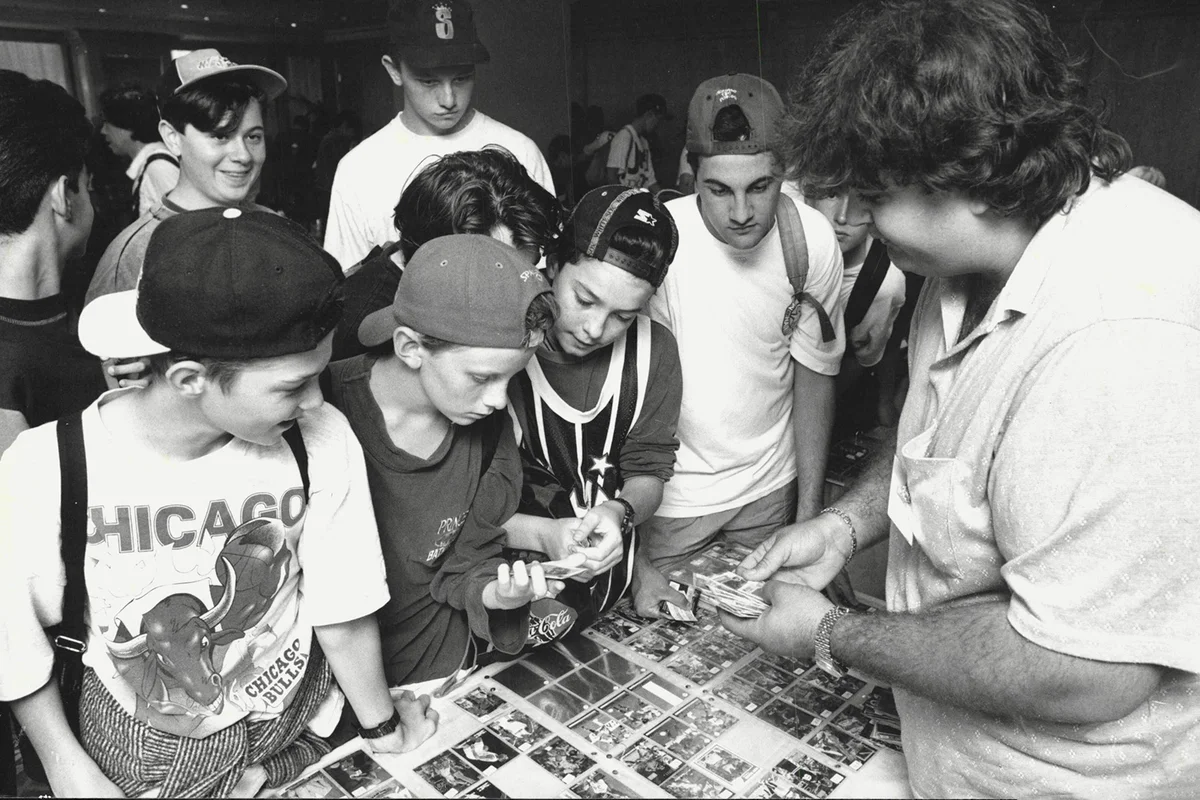 John Arronis sells some basketball cards Tom to prospective Byers - Getty Editorial Use