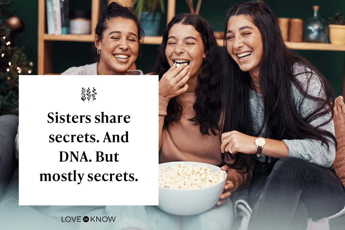 young sisters having popcorn and watching tv together