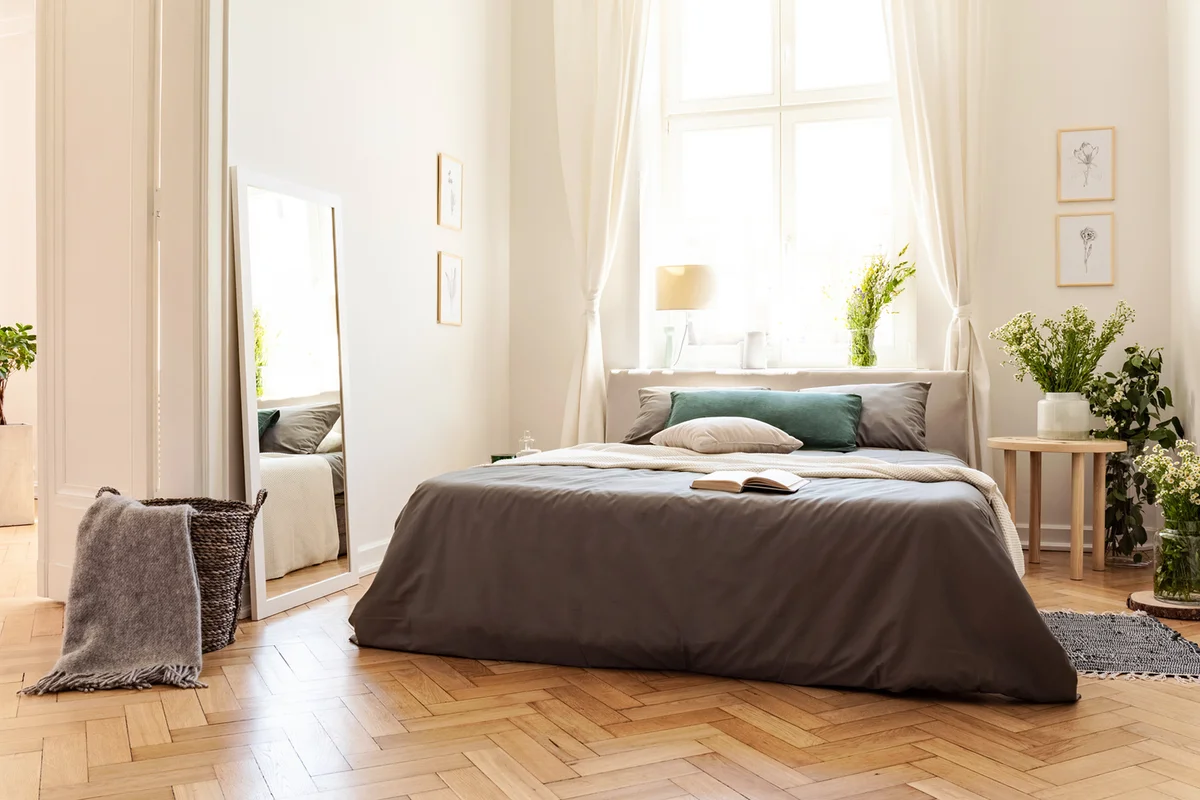 Bedroom with natural light and mirror