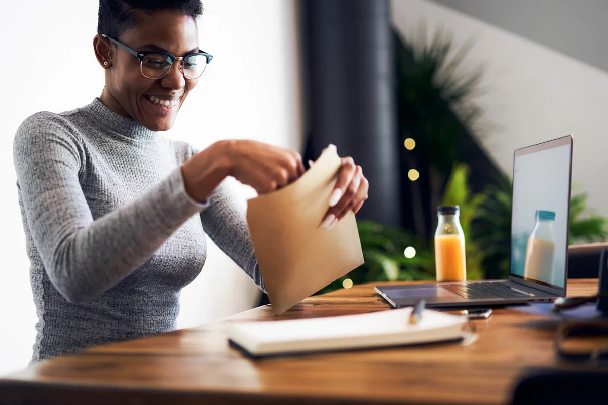 Woman opening experience gift