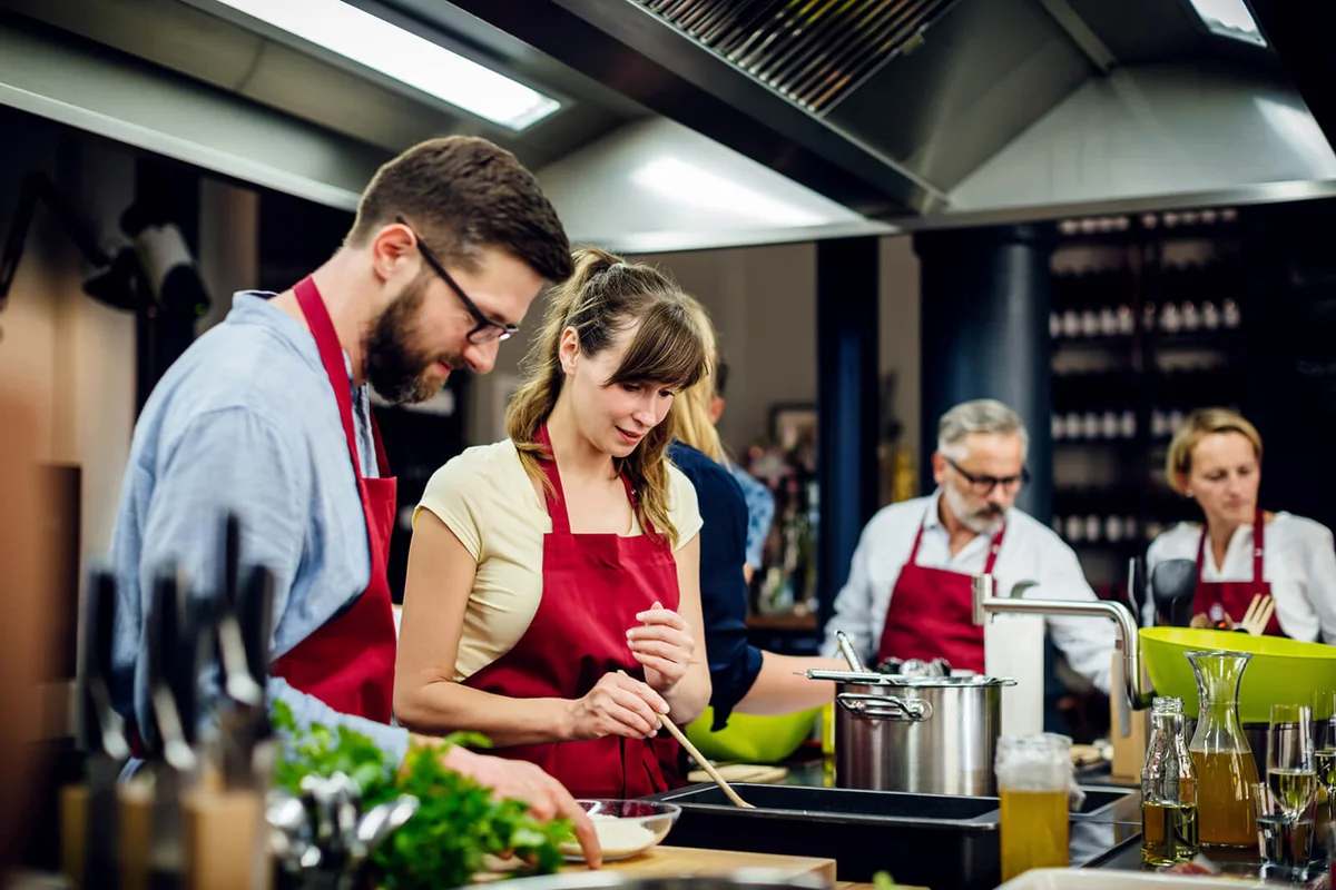 Chef assisting a cooking class