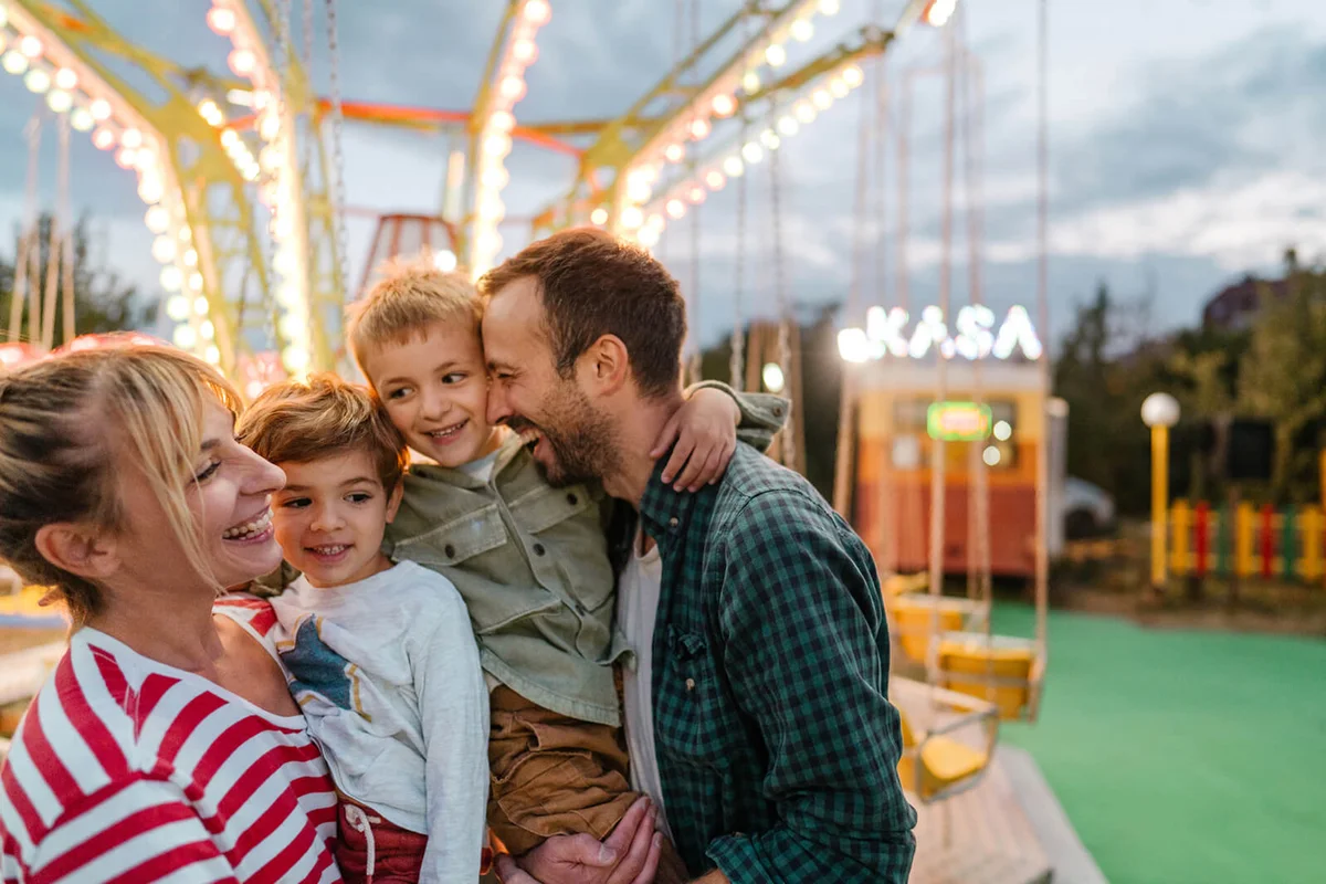 Happy family at the traveling fair