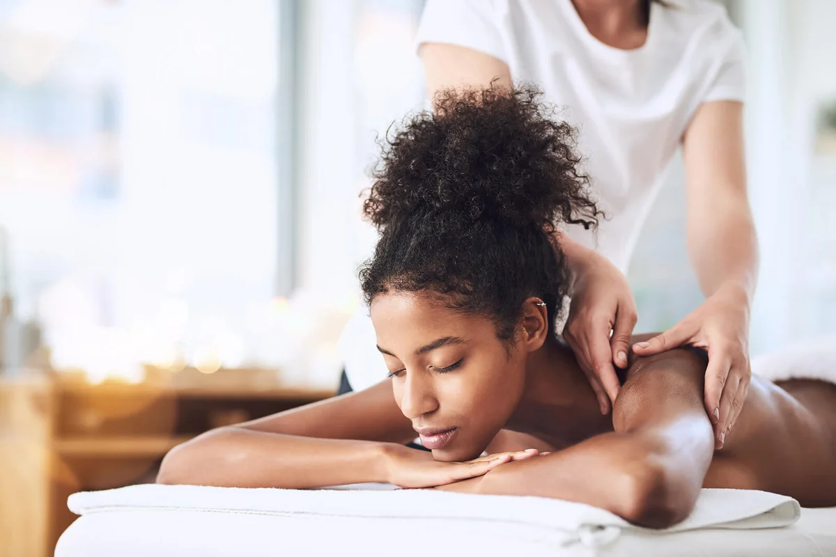 young woman getting a massage at a spa