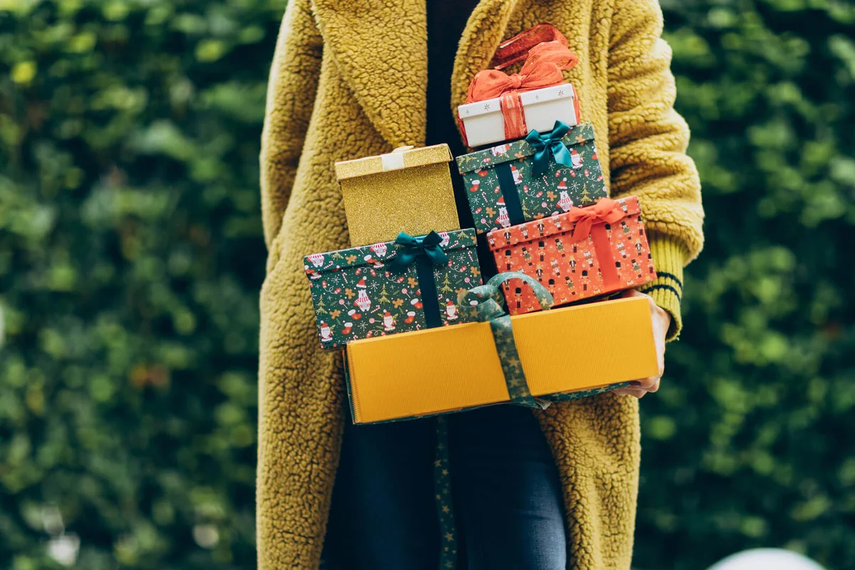 Woman holding Christmas gifts