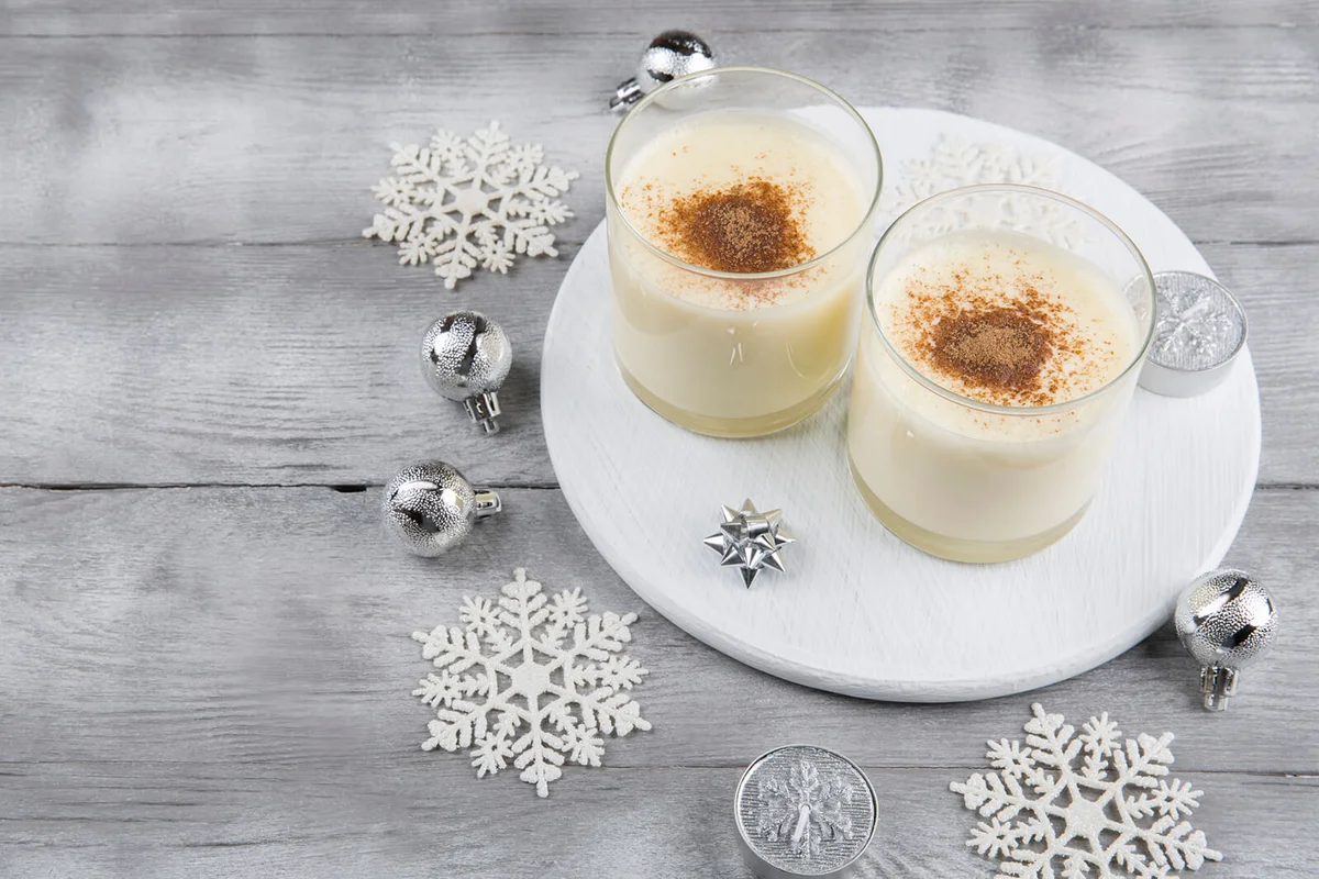 Two homemade eggnog with cinnamon