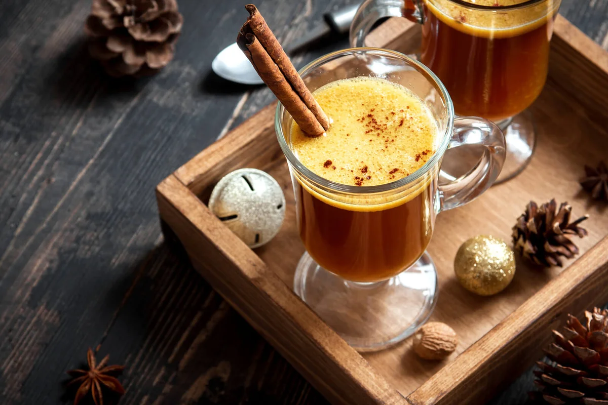 Hot buttered rum cocktail with cinnamon for Christmas