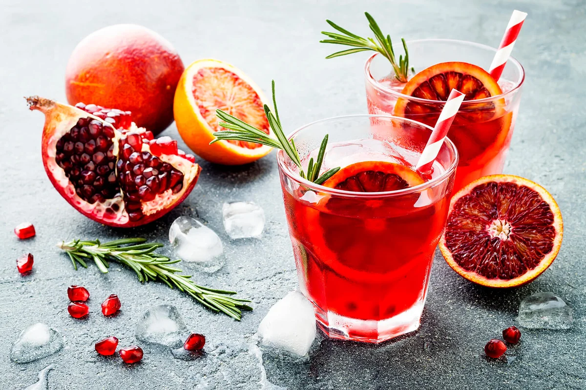 Red cocktail with blood orange and pomegranate