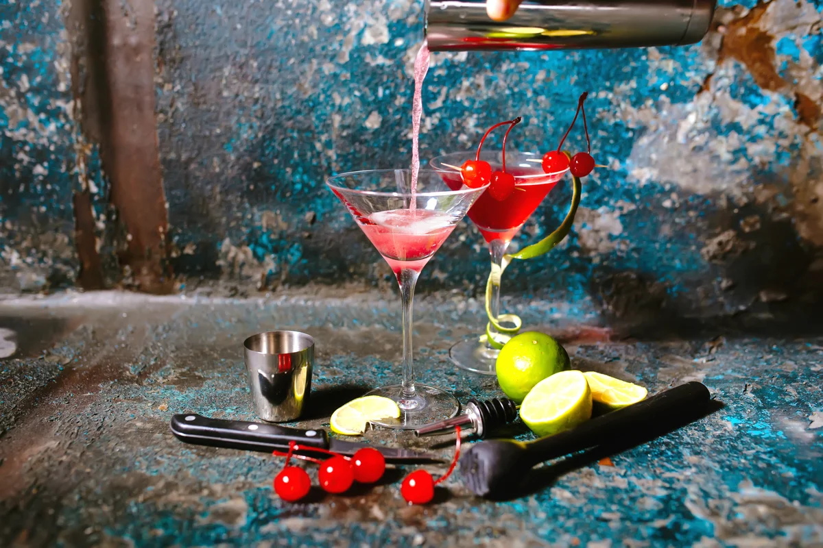 Man preparing Christmas margarita cocktails