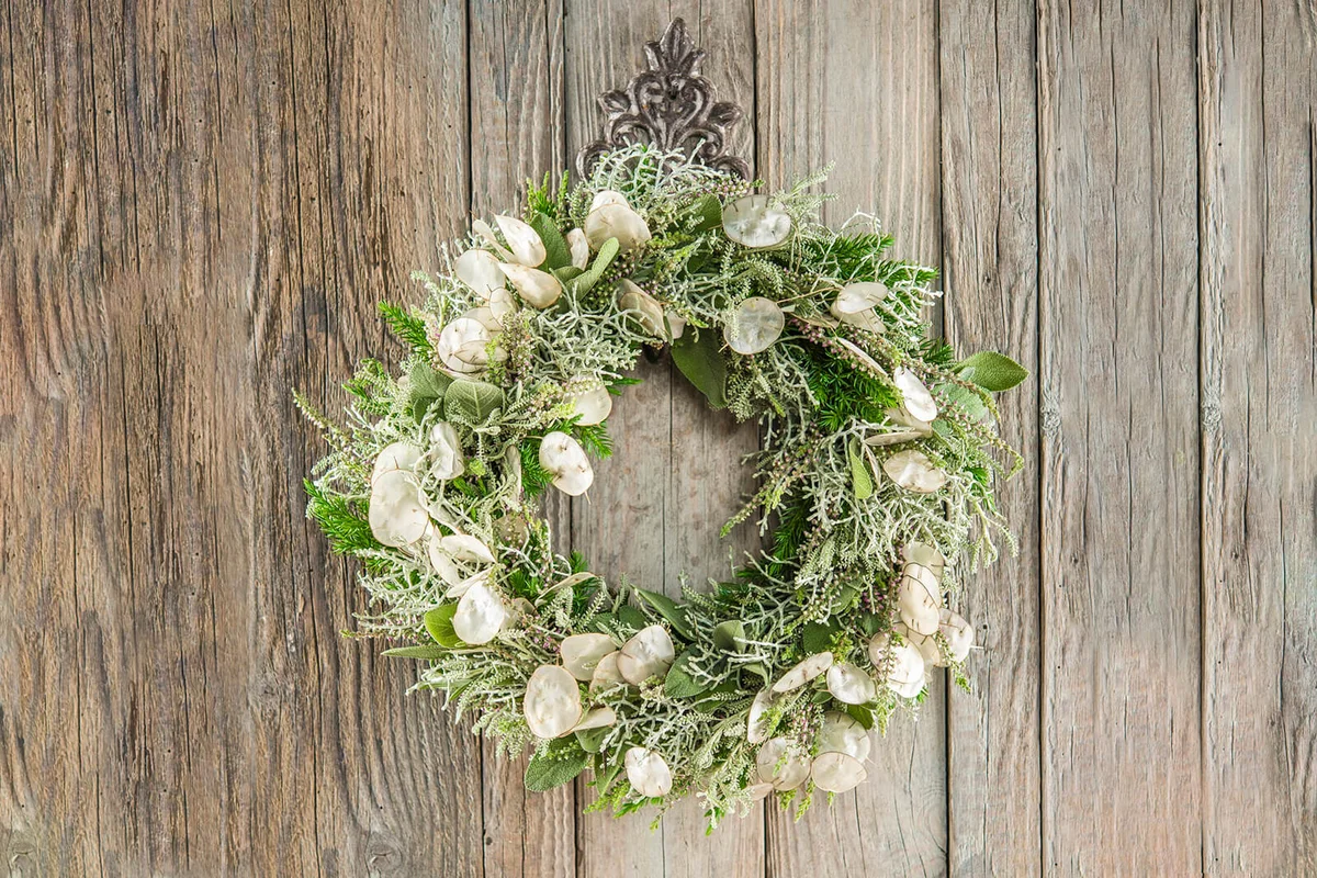 Autumn wreath on wooden wall