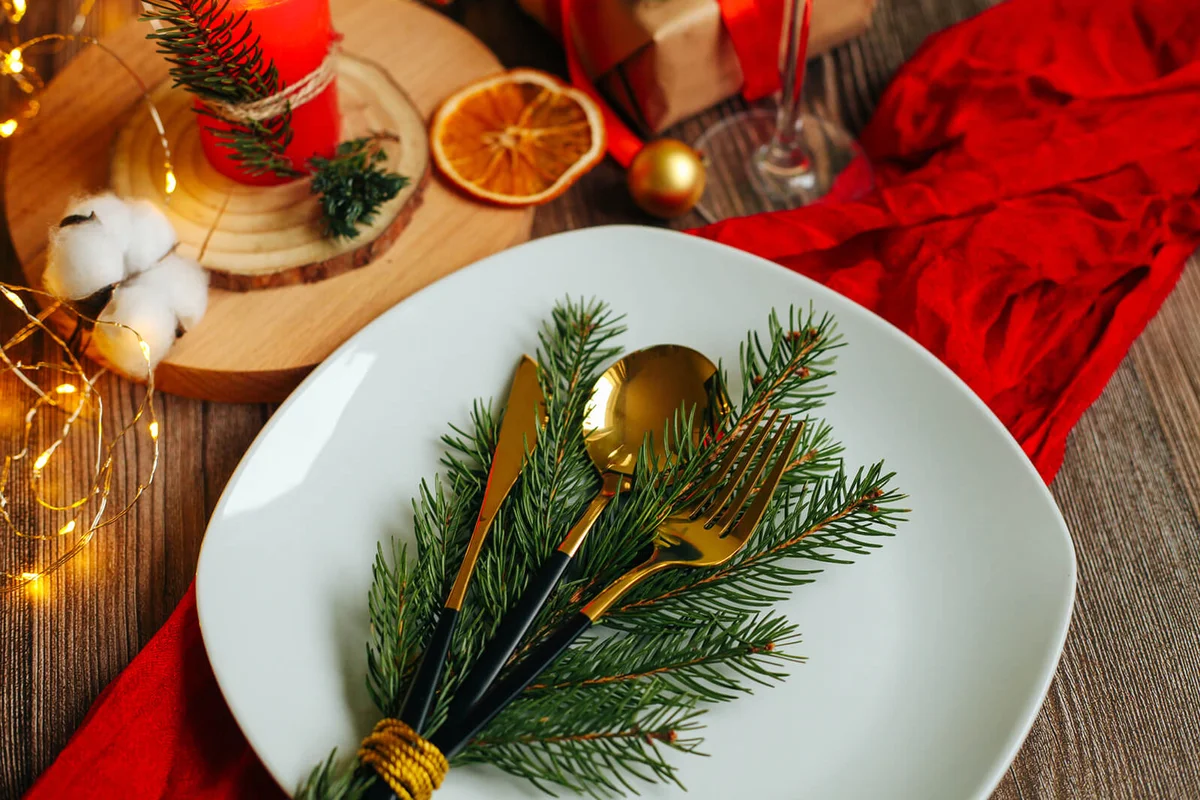 Pine tree branch, candle and decorations