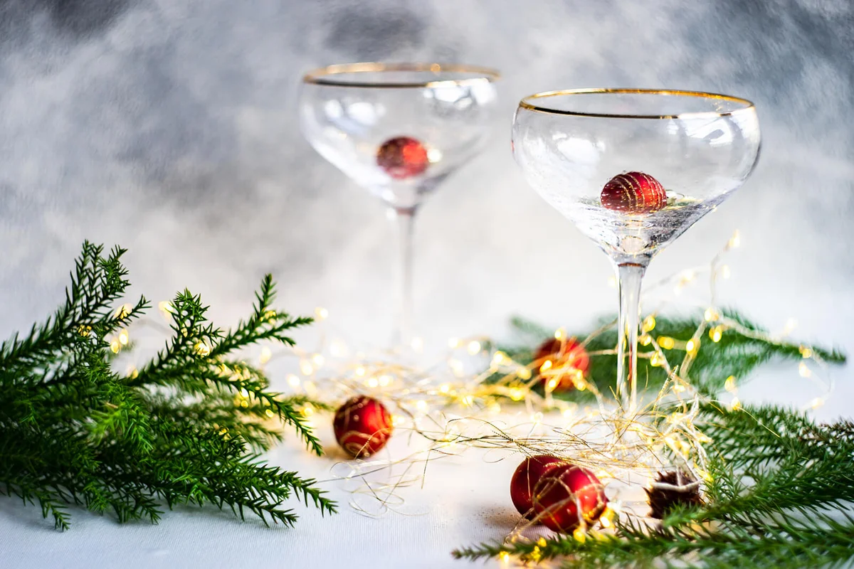 Christmas Party Celebration With Champagne Glasses And Lights