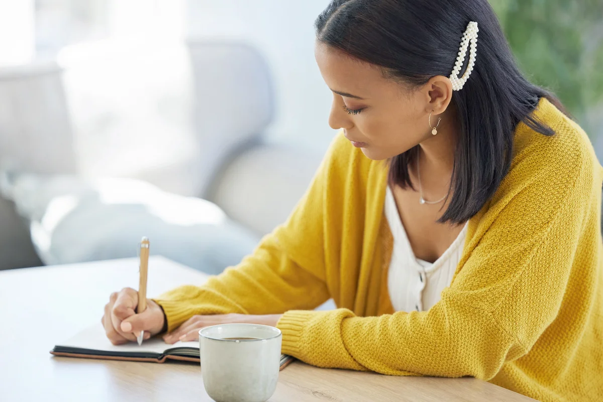 Woman writing in her journal