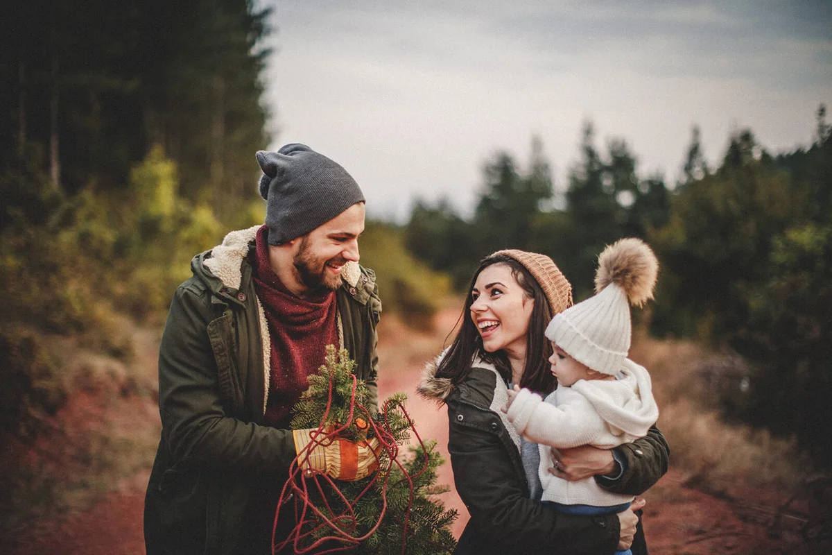 Couple with a tree cut from the forest