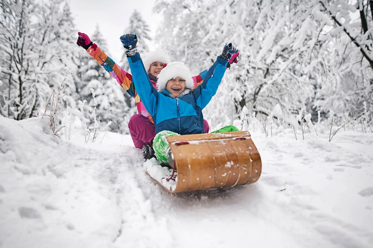 Kids tobogganing on Christmas